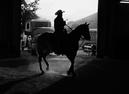 cowboy sitting on a horse