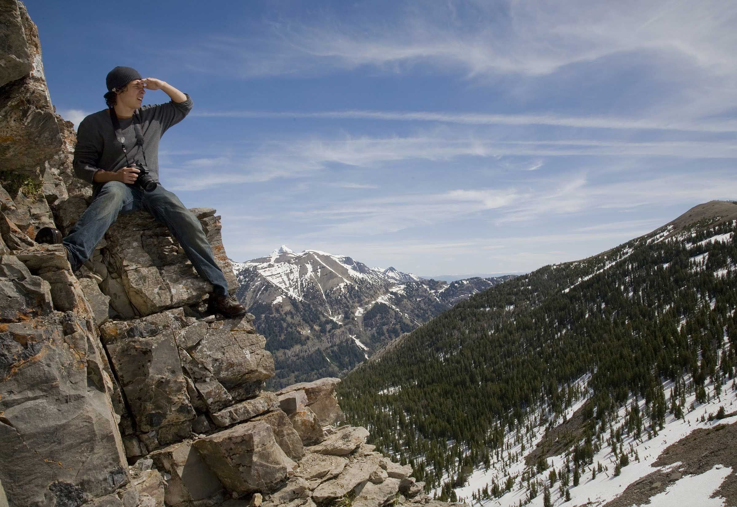 student on a mountain ridge